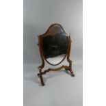 A 19th Century Shield Shaped Swing Dressing Table Mirror with Scrolled Feet, 52.5cm High
