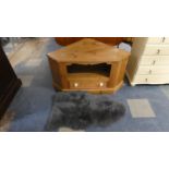 A Pine Corner TV/DVD Stand and a Sheep Skin Rug, 112cm Wide