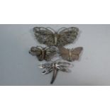 A Collection of Four Silver and White Metal Filigree Butterfly and Dragonfly Brooches