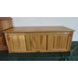 A Modern Pine Three Panelled Coffer Chest with Hinged Lid. 119cm long