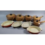 A Collection of Five Graduated Mushroom Enamelled Le Creuset Saucepans and Lids Together with Four