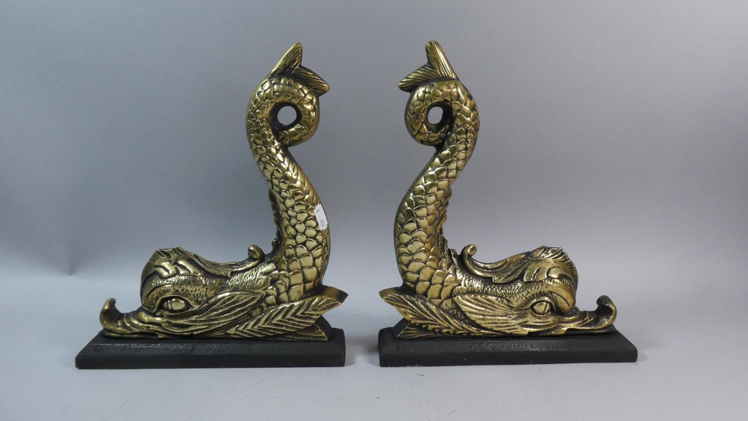 A Pair of Heavy Brass and Iron Doorstops or Fireside Ornaments in the Form of Dolphins, 29.5cm High