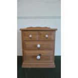 A Modern Pine Three Drawer Bedside Cabinet with Galleried Top, 55cm Wide