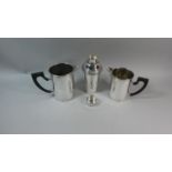 An Edwardian Silver Plated Cocktail Shaker and Two Cocktail Jugs