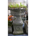 A Reconstituted Stone Campana Style Stone Urn on Square Plinth Base, 46cm Diameter