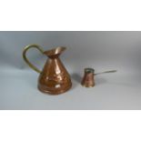 A Copper Measuring Jug and a Copper Spirit Warmer with Brass Handle