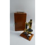 A Mahogany Cased Brass Microscope by Baker with Lenses and Bullseye Condenser Lens