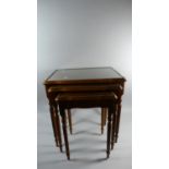 A Nest of Three Yew Wood Tables with Turned Reeded Supports, 52cm Wide