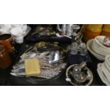 A Tray of Silver Plate to Include Two Circular Gallery Trays, Cutlery, Candle Stick, Cruets etc