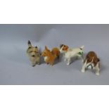 A Collection of Four Beswick Terriers