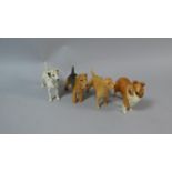 A Collection of Four Beswick Dogs