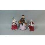 A Collection of Three Royal Doulton Figures, The Orange Lady, Christmas Morn and Best Wishes