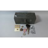 A Military Magazine Test Unit Box Containing Various Military Badges and Buttons Etc