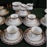 A Collection of Pompadour Pattern Teawares to Include Five Trios, Sugar and Cream