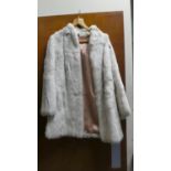 A Ladies Rabbit Fur Coat, Size 12