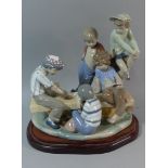 A Large Nao Figure Group, Five Boys Playing Cards on Wooden Plinth, 34cm Long