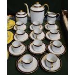 A Limoges Coffee Set to Include Eleven Cans and Saucers, Coffee Pot, Cream and Sugar etc