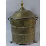 A Cylindrical Brass Lidded Coal Scuttle with Metal Liner on Three Brass Claw Feet, 31cm Diameter