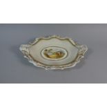 A 19th Century Cream and Gilt Oval Plate with Shaped Rim Enriched with Gilt Scrolled Decoration with