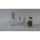 A Collection of Four Silver Mounted Glass Scent Bottles