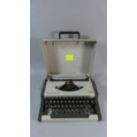 A Vintage AEG Olympia Traveller Deluxe S Portable Typewriter