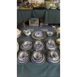 A Collection Real Old Willow Teawares to Include Six Trios, Sugar and Cream, Plates