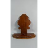 A 19th Century Mahogany Charger Stand with a Shaped Back supported on a Lead Loaded Plinth. 40x38cms