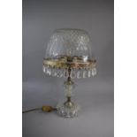 A Glass Table Lamp and Shade. The Silver Plated Rim Adorned with Glass Droppers, 38cm High