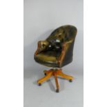 A Late 20th Buttoned Leather Swivel Office Tub Chair