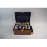 A 19th Century Walnut Fitted Work Box with Removable Tray Containing Silver Plate Top Glass Boxes