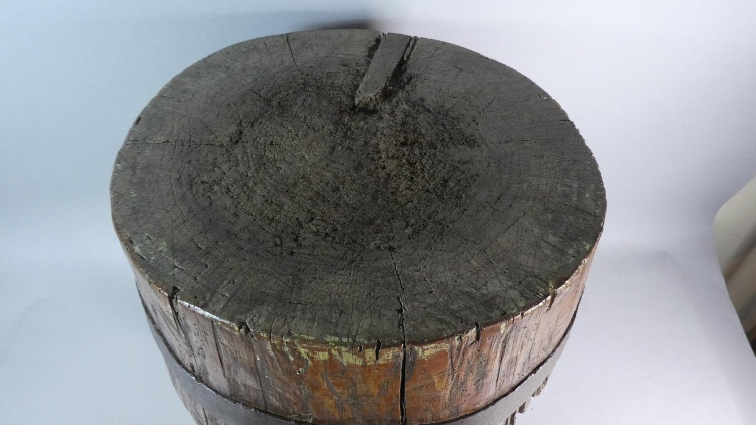 A 19th Century Primitive Chopping Block with an Iron Banded Ash Top supported on Three Oak Legs. - Image 2 of 2