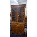 A Mid 20th Century Burr Walnut Astral Glazed Bookcase with Cupboard Base, Having Two Drawers, 92cm
