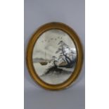 An Oval Japanese Framed Print with Gilt Highlights Depicting House, oats and Birds in Flight with