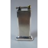 A Vintage Silver Plated Dunhill Lighter with Engine Turned Decoration. 10cms High