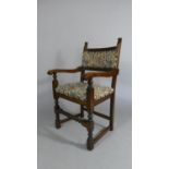 An Oak Framed Tapestry Upholstered Arm Chair