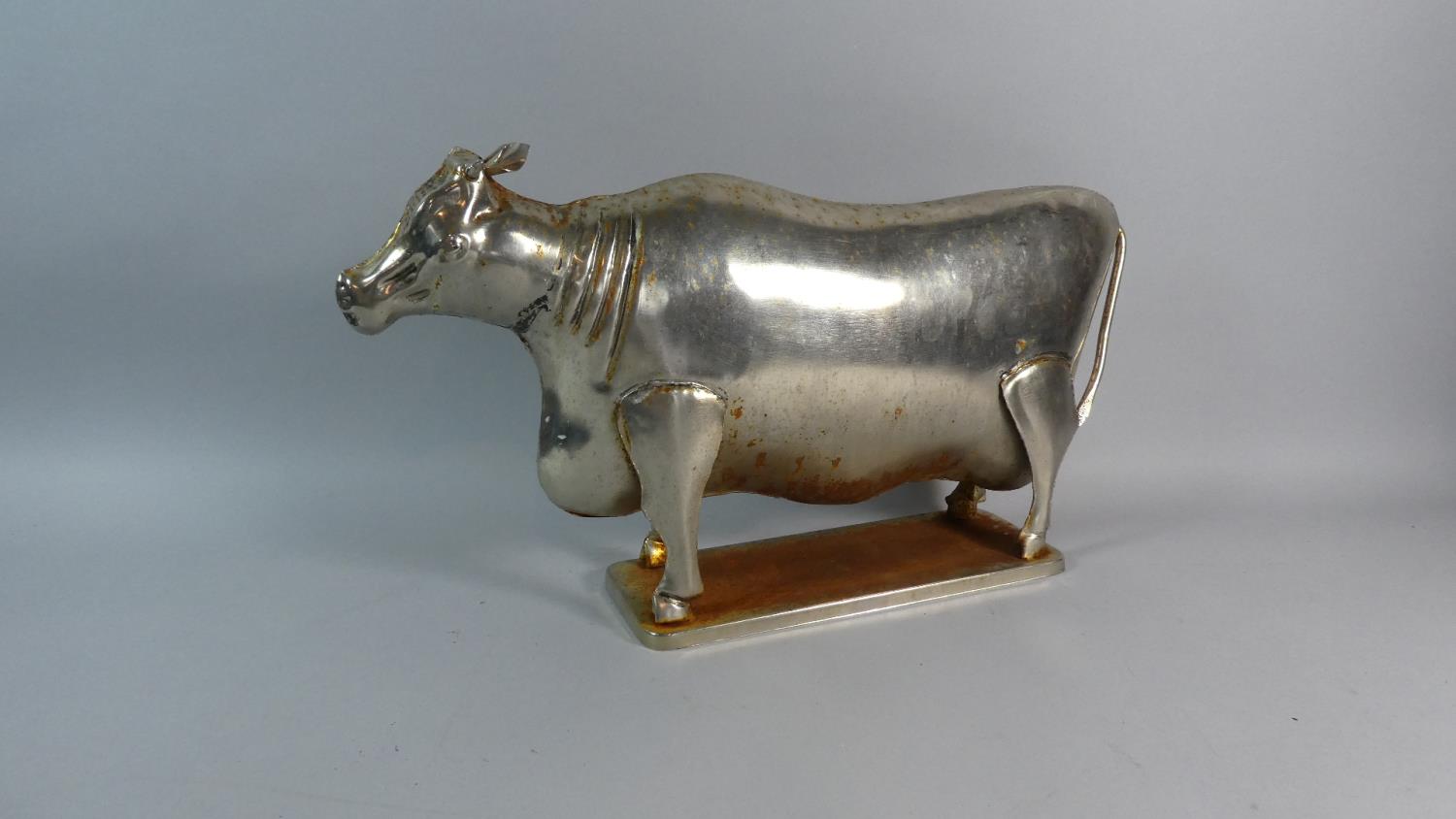 A Continental Butchers Shop Window Display, Metal Cow. 49cms Wide