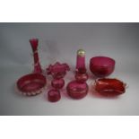 A Collection of Ten Pieces of Cranberry Glass to Include Sugar Sifter, Bowls, Vase and Jug