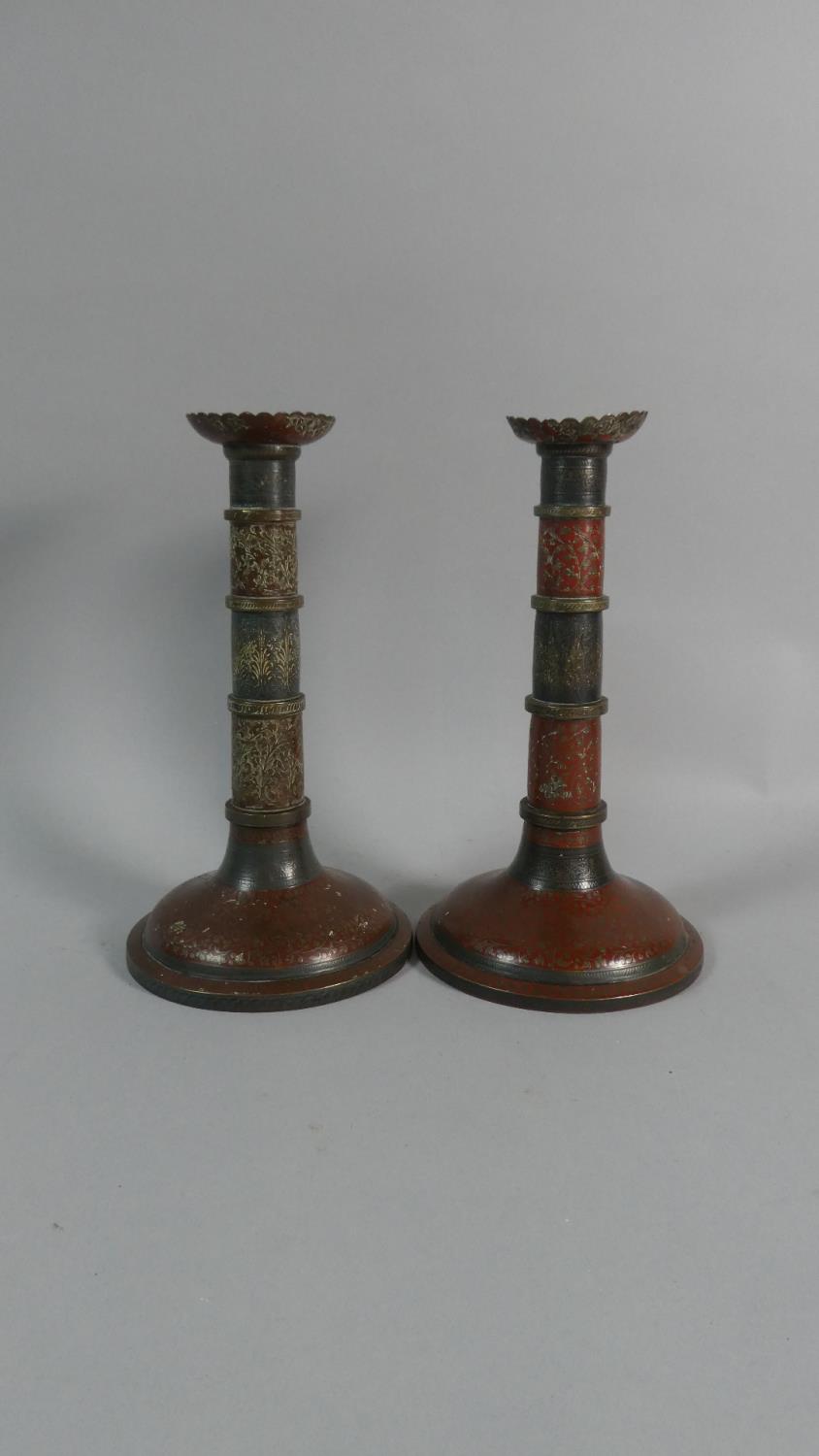 A Pair of 19th Century Indian Enamel Candlesticks. 24cms High