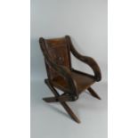 A 19th Century Miniature Oak Glastonbury Chair with Carved Back and Arms, 44cm High