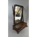 A Georgian Mahogany Swing Toilet Mirror on Plinth Base with Centre Long Drawer Flanked by Two