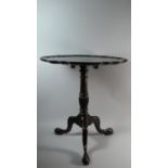 A Mahogany Piecrust Snap Top Tripod Table on Claw and Ball Feet. 60cms Diameter