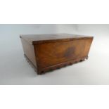 A Late 19th Century Walnut Sewing Box with Silk Lined Buttoned Interior, Shaped Apron and Bun