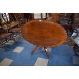 A Good Quality Oval Crossbanded Snap Top Coffee Table by Lawrences of Shrewsbury, Claw Feet and