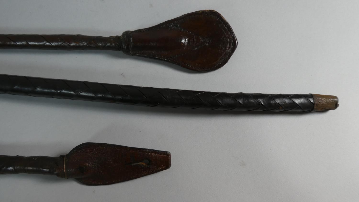 An Unusual Plaited Leather Walking Stick. 90cms Long and Two Plaited Leather Riding Crops, 60cms - Image 2 of 3