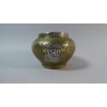 An Islamic Cairo Ware Brass Vase with Silver Overlay. 9cms High