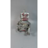 A Reproduction Cast Metal Bank in the Form of a Robot, 18cm High (Plus VAT)