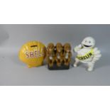 A Collection of Three Painted Cast Metal Reproduction Novelty Banks, Shell, Michelin and Three