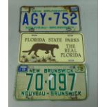 A Collection of Two New Brunswick American Car Number Plates and a Florida State Park Plate