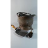 A Copper Helmet Shaped Coal Scuttle Together with Coal Shovel