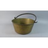 A Vintage Brass Jam Kettle with Iron Loop Handle, 30.5cm Diameter